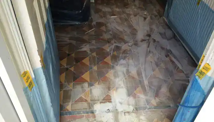 Professional cleaning process on a Minton tile floor in Tutbury during restoration work