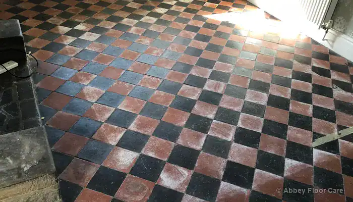 Diagram showing moisture rising through earth base and evaporating through breathable quarry tile floor